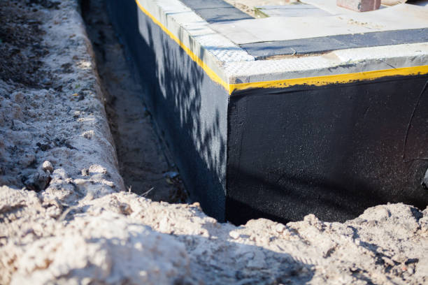 Professional Emergency Waterproofing technician working in Harrisburg, PA